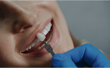 Dentist adjusts patient's braces