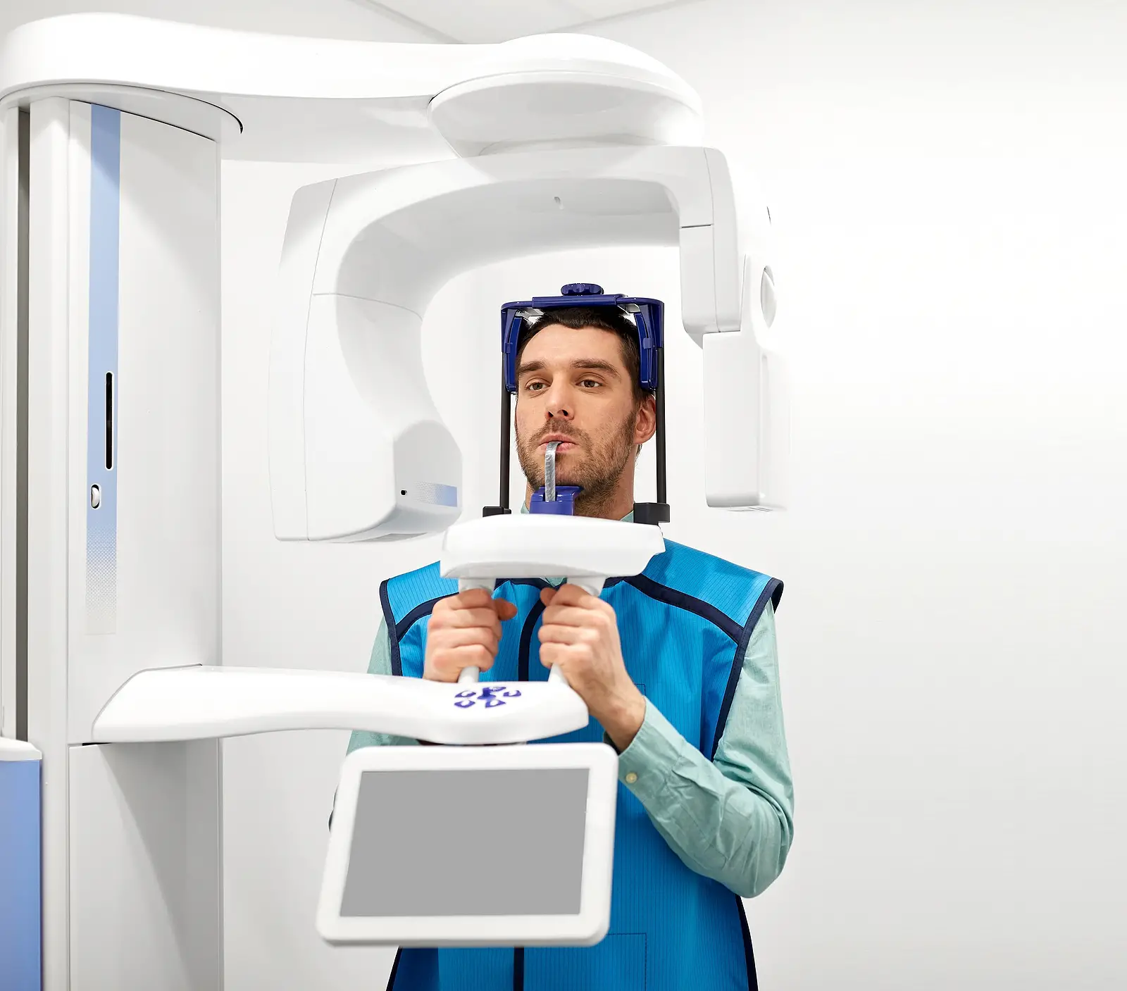Man in dental X-ray machine for panoramic scan