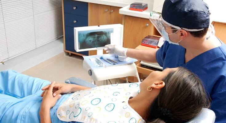 Dentist explaining an x-ray