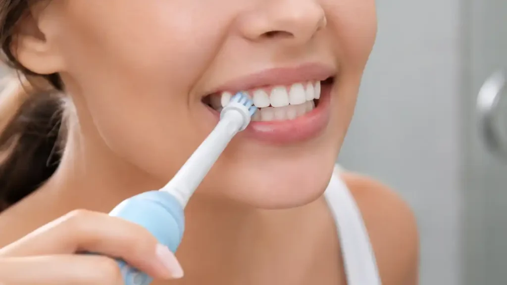 Proper toothbrushing technique using a soft-bristled electric toothbrush